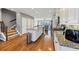 Spacious kitchen seamlessly connects to the living area with wood floors at 1222 Poston Se Pl, Smyrna, GA 30080