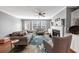 Cozy living room featuring a fireplace, ceiling fan, hardwood floors, and comfortable seating at 1222 Poston Se Pl, Smyrna, GA 30080