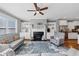 Inviting living room with fireplace, built-in shelving, hardwood floors, and lots of natural light at 1222 Poston Se Pl, Smyrna, GA 30080