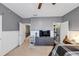 Comfortable carpeted main bedroom featuring a ceiling fan, tv, and walk-in closet at 1222 Poston Se Pl, Smyrna, GA 30080