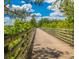 Picturesque walking trail with wooden fence and lush greenery, perfect for outdoor activities at 1222 Poston Se Pl, Smyrna, GA 30080