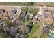 Aerial view featuring surrounding homes, roads, mature trees, large lots, and swimming pool at 1694 Mount Bethel Rd, Mcdonough, GA 30252