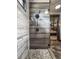 The frameless shower showcases custom tilework, pebble flooring, and rainfall shower head at 1694 Mount Bethel Rd, Mcdonough, GA 30252