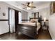 Bedroom with hardwood floors, a four-poster bed, and natural light at 1694 Mount Bethel Rd, Mcdonough, GA 30252