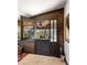 Entryway with wood paneling, tile flooring and a pass-through window at 1694 Mount Bethel Rd, Mcdonough, GA 30252