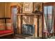 Close up of fireplace, wood mantle, brick facade and decorative accents at 1694 Mount Bethel Rd, Mcdonough, GA 30252