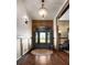 Elegant foyer with hardwood floors, decorative lighting, and a beautiful front door with leaded glass at 1694 Mount Bethel Rd, Mcdonough, GA 30252