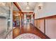 Open foyer with rich wood flooring, stylish lighting, and views into the living spaces at 1694 Mount Bethel Rd, Mcdonough, GA 30252