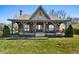 Lovely home with a spacious covered porch, perfect for relaxing, surrounded by a well-maintained lawn at 1694 Mount Bethel Rd, Mcdonough, GA 30252