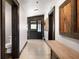 Hallway with decorative wood accents, tiled floors, and doors leading to other rooms at 1694 Mount Bethel Rd, Mcdonough, GA 30252