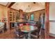 Kitchen featuring brick walls, custom cabinetry, stainless steel appliances, and a large island at 1694 Mount Bethel Rd, Mcdonough, GA 30252