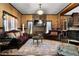 Living room featuring elegant sofas, ornate accents, fireplace, and a decorative rug at 1694 Mount Bethel Rd, Mcdonough, GA 30252