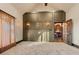 Open-concept living room with paneled wall, dark wood trim, and natural light at 1694 Mount Bethel Rd, Mcdonough, GA 30252