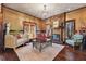 Elegant living room with hardwood floors, fireplace, and ample natural light from large windows at 1694 Mount Bethel Rd, Mcdonough, GA 30252