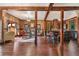 Open-concept living space with hardwood floors, fireplace, and seamless flow to kitchen and dining areas at 1694 Mount Bethel Rd, Mcdonough, GA 30252