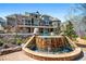 Luxury home featuring an infinity pool with a waterfall, landscaped yard, and outdoor living spaces at 268 Hanson Way, Marietta, GA 30064