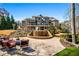 Beautiful backyard featuring a waterfall, manicured landscape, and multi-level outdoor living spaces at 268 Hanson Way, Marietta, GA 30064