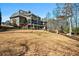 Expansive backyard featuring a waterfall and patio with outdoor seating and manicured lawn at 268 Hanson Way, Marietta, GA 30064