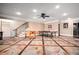 Finished basement with foosball and ping pong tables, as well as custom flooring at 268 Hanson Way, Marietta, GA 30064