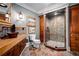 Luxurious bathroom with custom cabinets, stone floors, and a tiled glass shower at 268 Hanson Way, Marietta, GA 30064