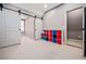 Bonus room featuring barn doors, a set of colorful storage cubes and neutral walls at 268 Hanson Way, Marietta, GA 30064