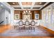 Elegant dining room with coffered ceiling, chandelier, and natural light at 268 Hanson Way, Marietta, GA 30064
