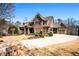 Beautiful home featuring an attached two car garage, stone accents, and a wide driveway at 268 Hanson Way, Marietta, GA 30064
