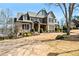 Charming two-story home with stone accents, mature landscaping, and a well-manicured lawn at 268 Hanson Way, Marietta, GA 30064