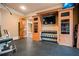Home gym area with full set of weights and storage in custom wood cabinets at 268 Hanson Way, Marietta, GA 30064