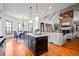 Bright and spacious kitchen with stainless steel appliances, island, stone fireplace and eat-in kitchen area at 268 Hanson Way, Marietta, GA 30064