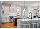Bright kitchen with white cabinets, stainless steel appliances, center island, and breakfast bar seating at 268 Hanson Way, Marietta, GA 30064