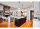Spacious kitchen with stainless steel appliances, center island, open layout and hardwood floors at 268 Hanson Way, Marietta, GA 30064
