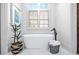Elegant bathroom features a freestanding soaking tub with modern fixtures and bright natural light at 268 Hanson Way, Marietta, GA 30064