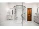 Luxurious main bathroom with double sinks, marble countertops, and a frameless glass shower at 268 Hanson Way, Marietta, GA 30064