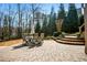 Outdoor patio with table and chairs, brick pavers, and landscaped steps at 268 Hanson Way, Marietta, GA 30064