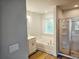 Bathroom features a shower and soaking tub, frosted window at 309 Melanie Ct, Bowdon, GA 30108