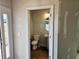 Half bathroom with a pedestal sink and toilet at 309 Melanie Ct, Bowdon, GA 30108