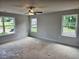Bedroom with bright windows and ceiling fan at 309 Melanie Ct, Bowdon, GA 30108