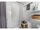 Bright bathroom featuring a white tub, gray curtain, and decor shelves at 1050 Boulevard Ne Dr, Atlanta, GA 30317