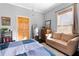 Comfortable bedroom with large windows, seating, decor, and hardwood floors at 1050 Boulevard Ne Dr, Atlanta, GA 30317