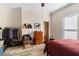 Bedroom featuring a large bed, decor, and clothing rack at 1050 Boulevard Ne Dr, Atlanta, GA 30317