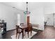 Dining area featuring modern light fixture, table, and access to an adjacent living space at 1050 Boulevard Ne Dr, Atlanta, GA 30317