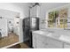 Kitchen with double basin sink that leads to the laundry room at 1050 Boulevard Ne Dr, Atlanta, GA 30317