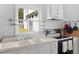 Close up of kitchen with double basin sink and backyard view at 1050 Boulevard Ne Dr, Atlanta, GA 30317