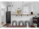 Bright kitchen featuring white cabinets, bar-style seating, and modern light fixtures at 1050 Boulevard Ne Dr, Atlanta, GA 30317