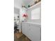 Bright laundry room with modern appliances and convenient storage shelves at 1050 Boulevard Ne Dr, Atlanta, GA 30317