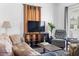 Bright living room featuring a neutral color palette, modern TV, and natural lighting at 1050 Boulevard Ne Dr, Atlanta, GA 30317