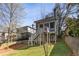 Backyard view showcasing the elevated deck, stairs and yard at 213 Oak Ln, Decatur, GA 30030