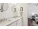 Elegant bathroom featuring double vanity, marble countertops, and access to the bedroom at 213 Oak Ln, Decatur, GA 30030