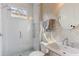 Modern bathroom with glass shower, stylish tiling, and elegant fixtures at 213 Oak Ln, Decatur, GA 30030